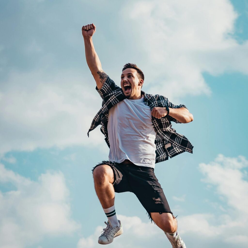 Low Angle Photography of Man Jumping