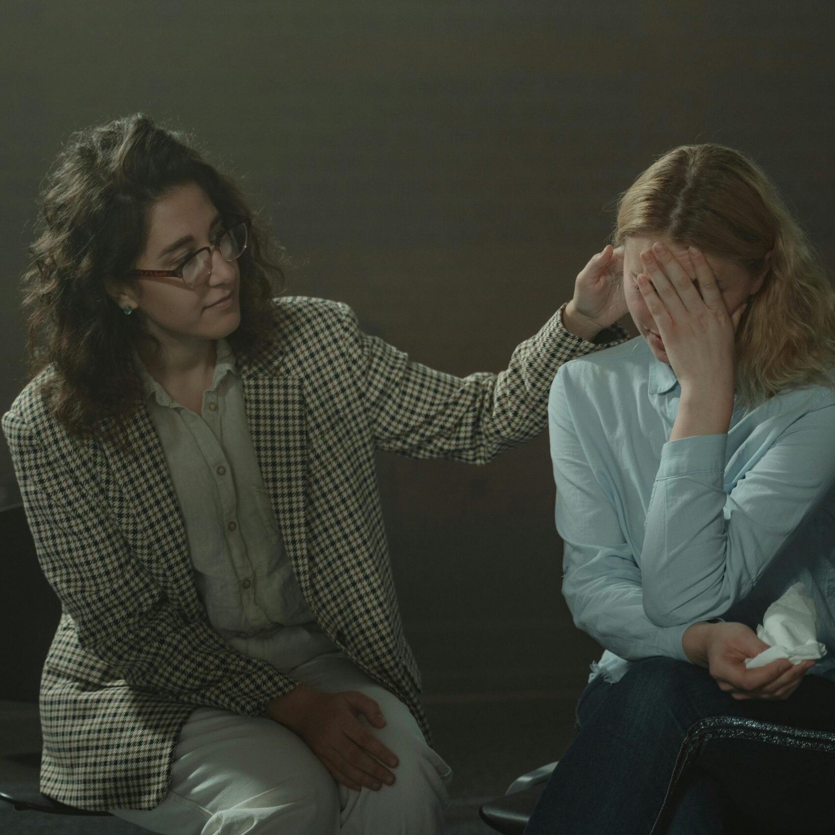 A comforting moment during a support session, highlighting empathy and understanding.